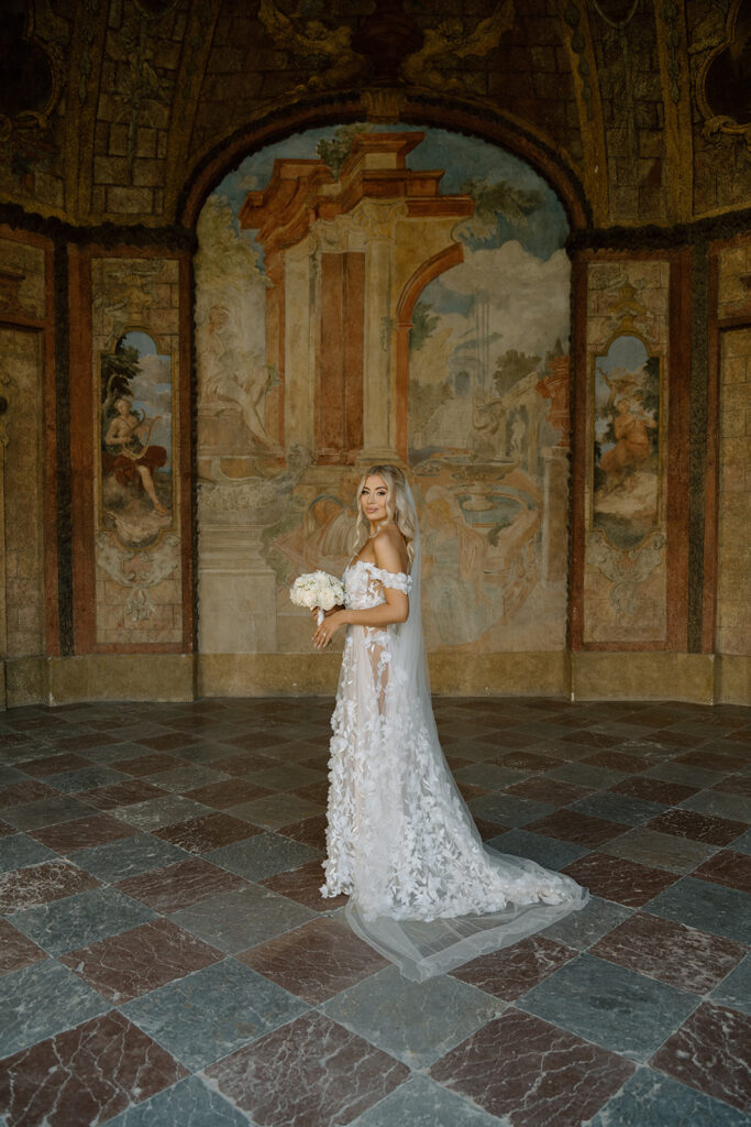 Bride after wedding ceremony in Vrtba Garden, Prague by Lucie Muse photographer