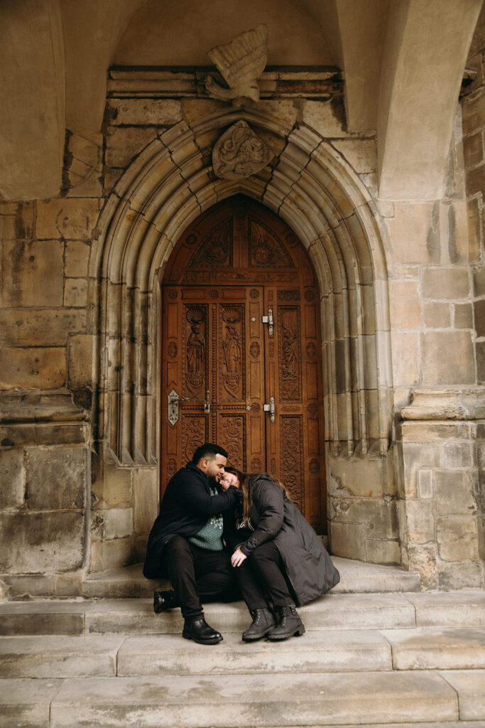 Couple embracing after a proposal at Prague Castle