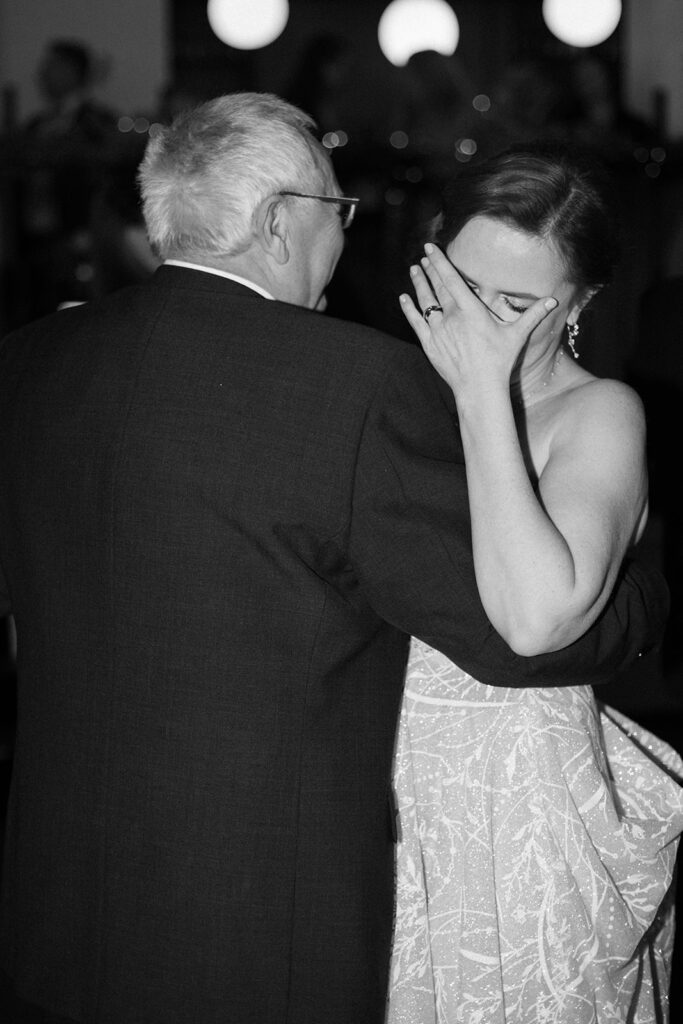 Touching moment between bride and her father during a Prague wedding – Emotional storytelling by artistic wedding photographer Europe – Candid family connection.