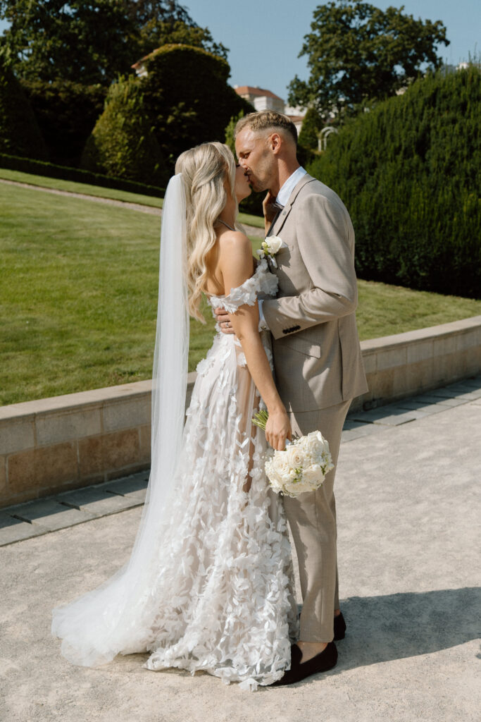 Intimate Prague elopement photoshoot with a couple walking through Vrtba Garden.