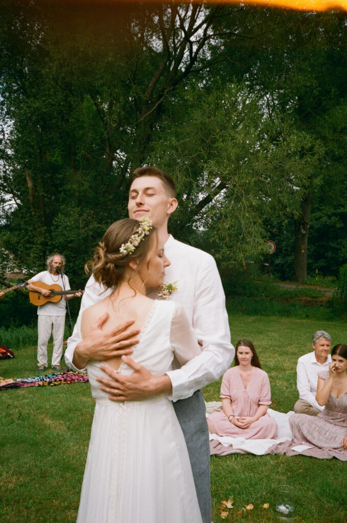 Intimate couple embrace in Prague captured on 35mm film – Artistic wedding photographer Europe – Timeless analog photography