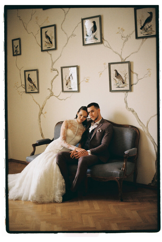 the bride and the groom during intimate moment after their ceremony in lobkowicz palace in prague captured on film by wedding photographer lucie muse