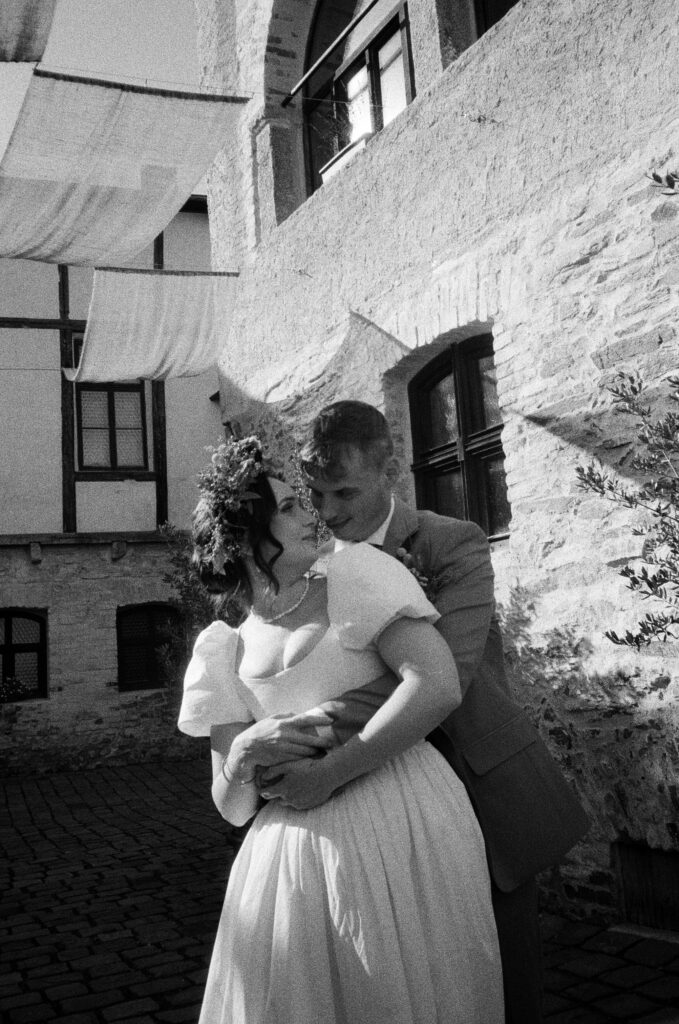 intimate moment during couple photoshoot captured on film by lucie muse